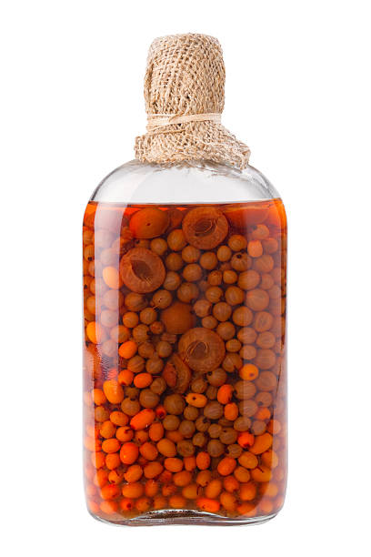"bottle of preserved fruits and berries, isolated"